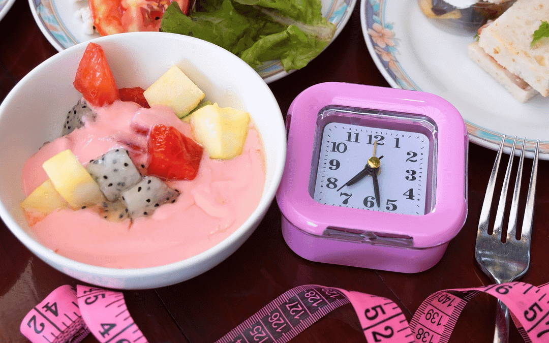healthy foods pink clock and pink tape measure