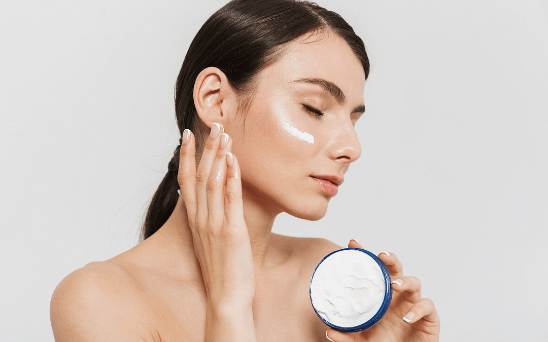 female with moisturizer on face