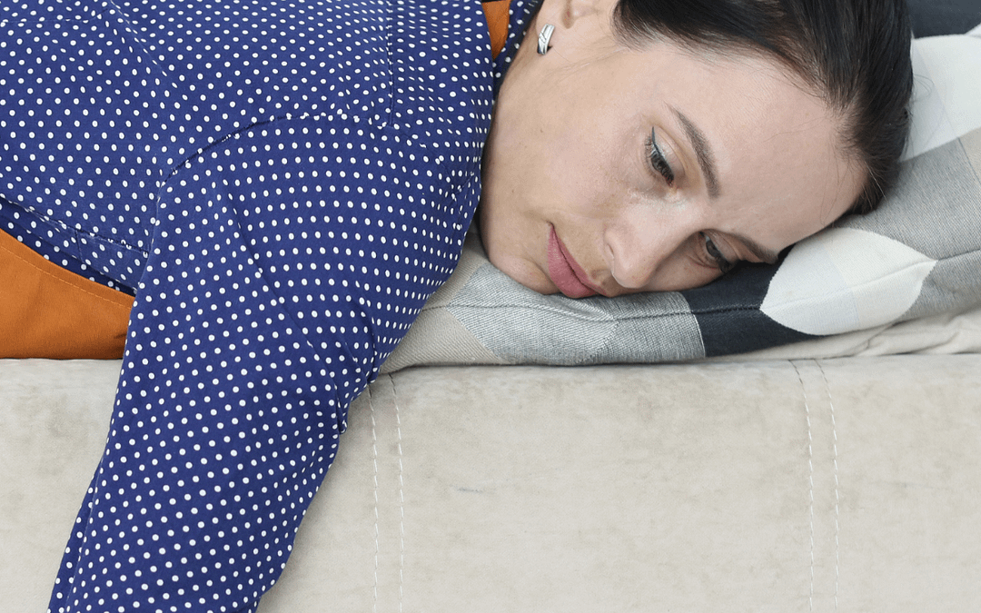 female lying down feeling sluggish
