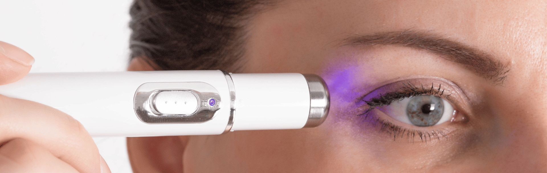 Female receiving scar repair treatment left eye